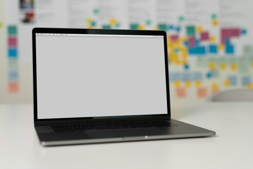 Project planning workspace with task boards and a laptop